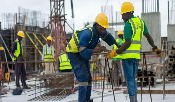 Site engineers reviewing construction progress, representing the project development timeline of a residential high-rise