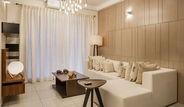Naturally lit living room interior of a high-rise apartment at Sattva Courtyard, East Bengaluru