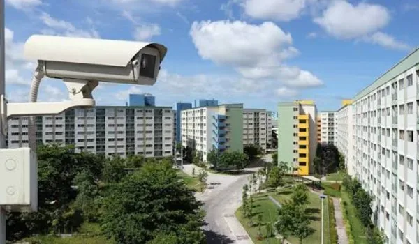 CCTV surveillance camera overlooking a residential complex representing gated community security systems